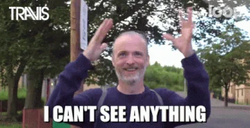 A GIF of white man waving his arms around saying "I can't see anything"