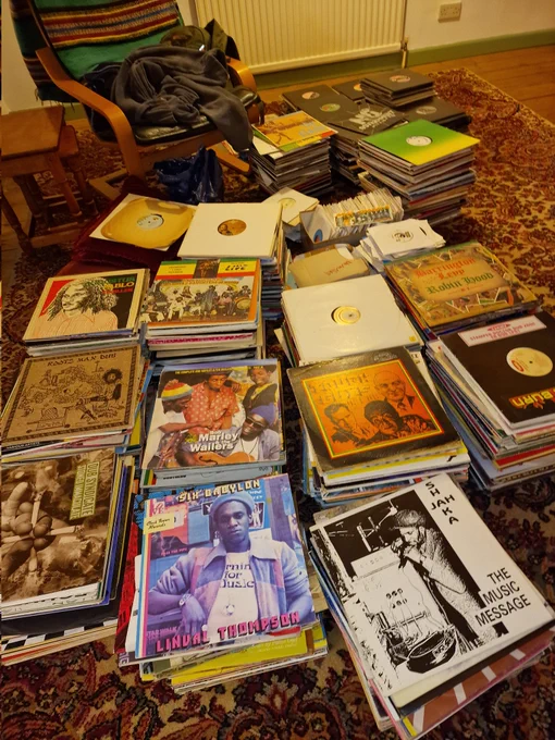 Piles of 10" & 12" 45s and then some accumulated (collected surely) LPs. Not a good way to store them, but it's a temporary thing. Next step,  on to shelving.