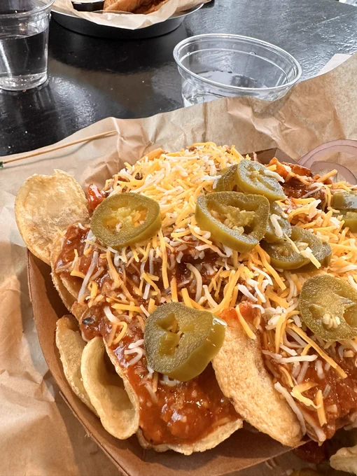 “Nachos” with unmelted cheese, chili, jalapeños and potato chips.