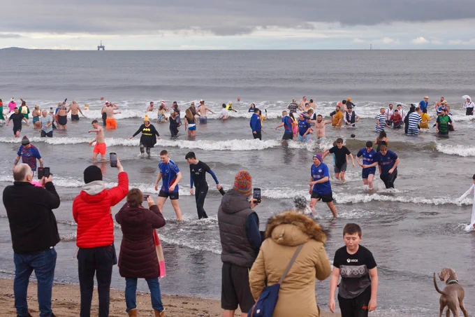 People in the sea as part of the loony dook