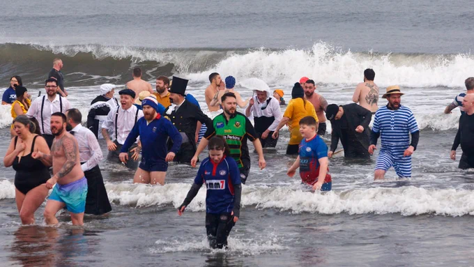 People in the sea as part of the loony dook