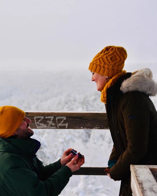 James also proposing to Bethany in the middle of a snowy forest.