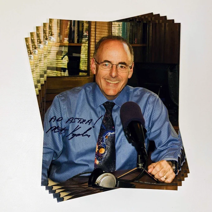 This is a picture of a stack of signed images of Mat Kaplan, creator and former host of Planetary Radio.