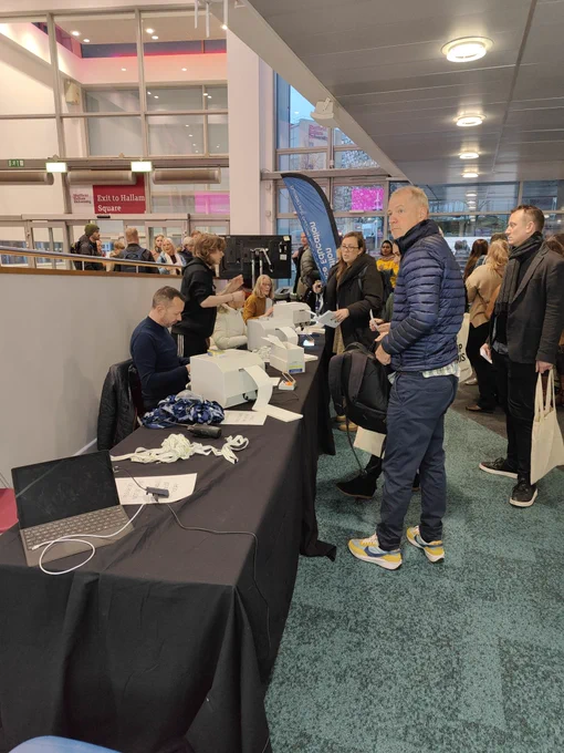 Delegates queueing to get their badge 