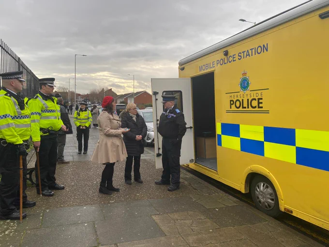 PCC Emily Spurrell with Angela Eagle MP and officers from Wirral Police 
in front of the mobile police station in Wallasey Village