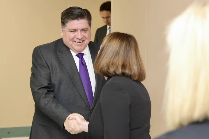 Governor Pritzker shakes hands with Ball-Chatham School District Superintendent, Dr. Becca Lamon.