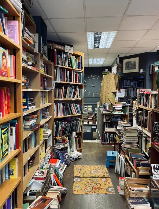 A picture of Crofton Books’ interior: basically piles and piles of books. 