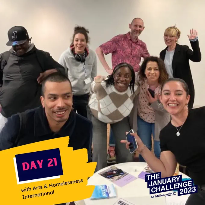 A group of people smiling with overlaid text “DAY 21 with Arts & Homelessness International” 