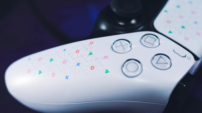 The faceplate of the SIE DualSense Controller. It has PlayStation Icons in color. The icon face buttons are pictured.