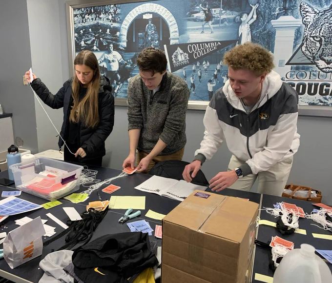 Students working at event