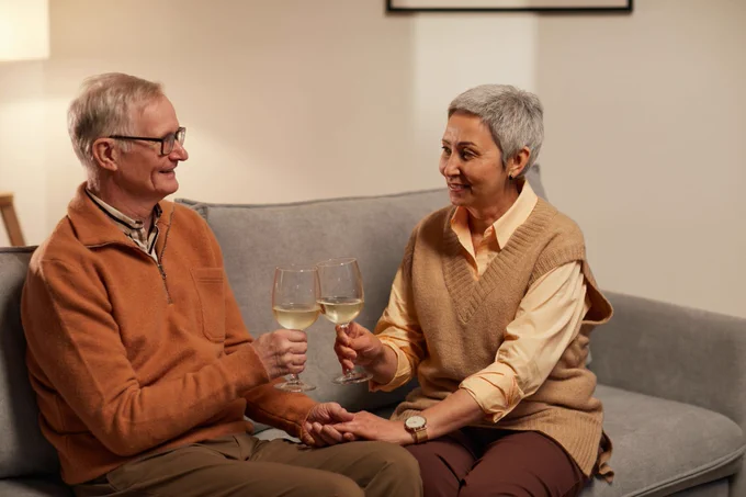Older couple drinking wine
