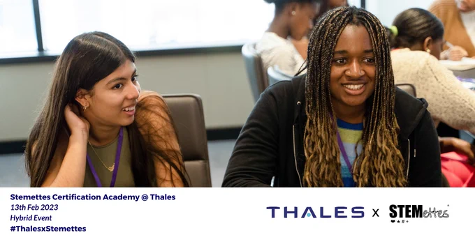 Two young girls smiling 