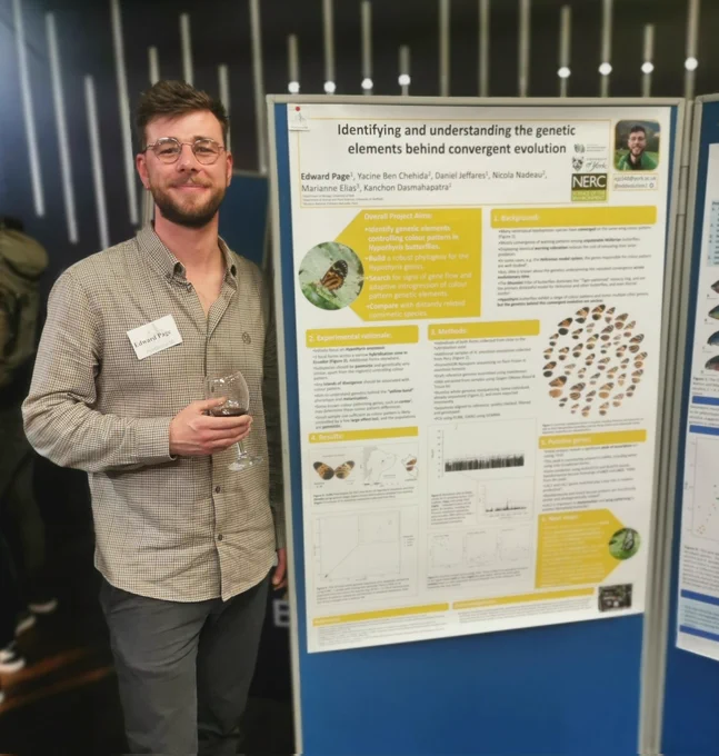 Me, standing in front of my poster, entitled "Identifying and understanding the genetic elements behind convergent evolution". 