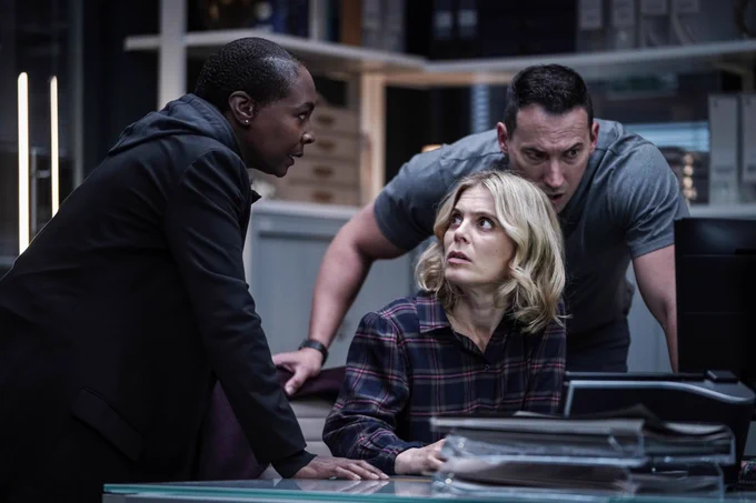 Image shows Torres, Nikki Alexander and Jack Hodgson looking at a computer screen. Torres appear to having a serious conversation with Nikki.