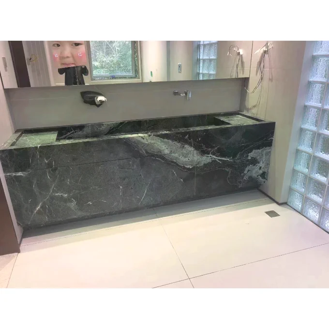 Commercial bathroom bench. Green marble. Stone. Marble slab