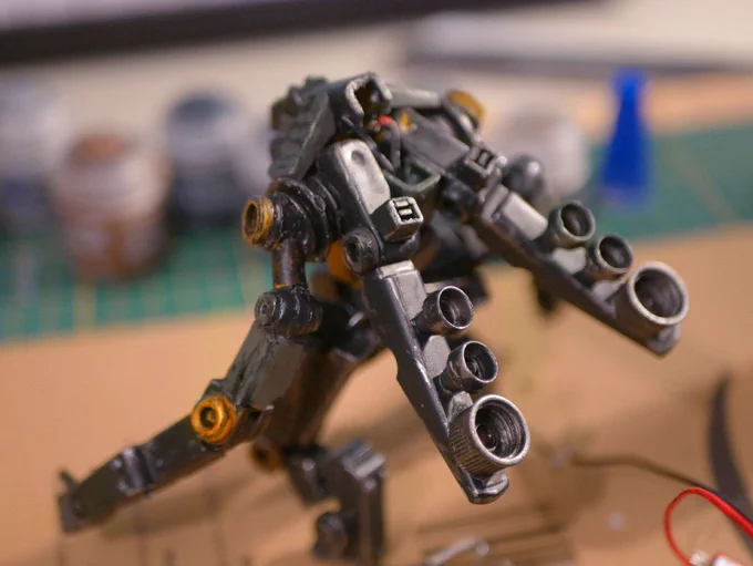 a cyclops robot made from clothespin and bead back, it has reactors hooked