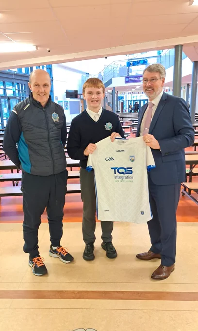 Jamie Dundon,  Ardscoil na Mara, receiving his prize for the Waterford Post Primary Schools Gaa Promotional Competition. A Waterford Jersey is presented to Jamie by Padraig Cawley, Principal Ardscoil na Mara.