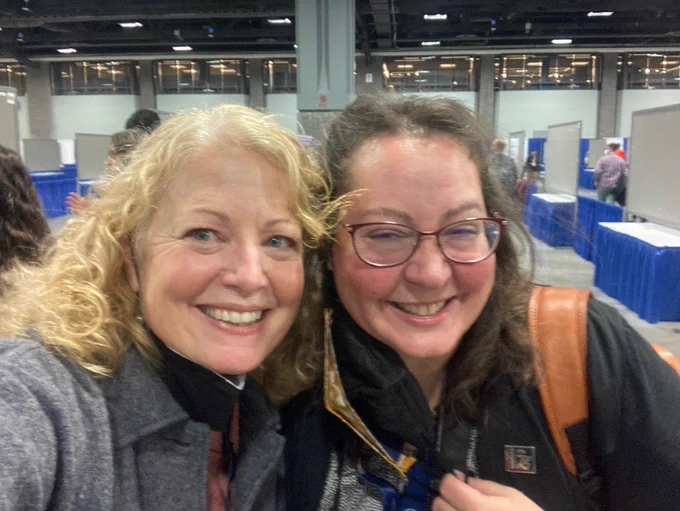 SafeTREC communications manager Lisa Peterson smiles, taking a selfie at TRBAM with Berkeley ITS communications director Amanda Cairo, also smiling!
