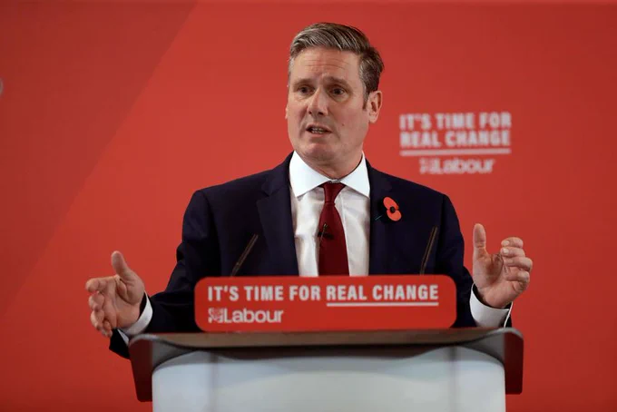Photo of Labour leader, Sir Keir Starmer, at a lectern against a red background with the slogan 'It's time for real change'