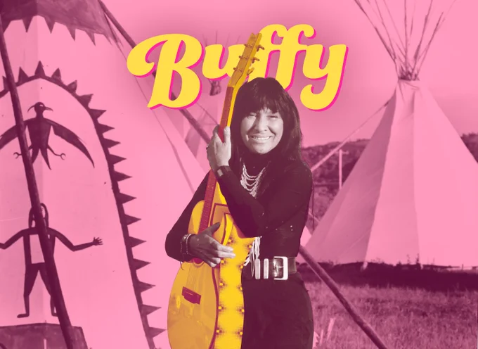A black and white photo of Buffy holding a guitar standing in a field in front of two teepees that has been colourized pink and yellow. The title Buffy is written behind her. 
