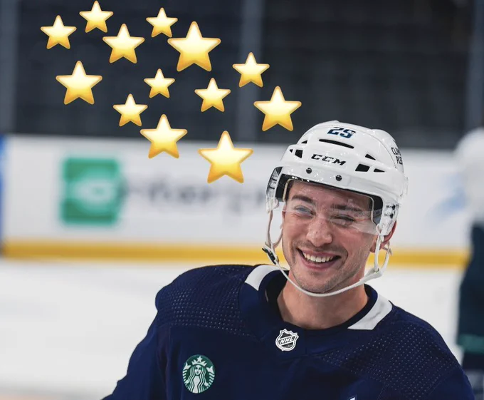 Vince Dunn smiling during practice with star emojis photoshopped on