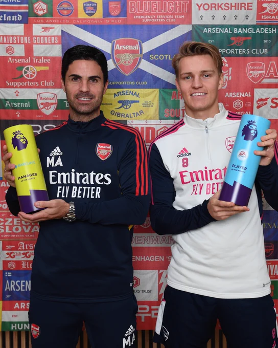 Mikel Arteta and Martin Odegaard holding the MOTM and POTM awards