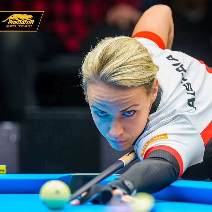 Jasmin Ouschan focusing on a shot during a pool tournament.
