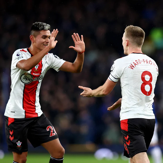 Charly Alcaraz high fives James Ward-Prowse after the latter's second goal.