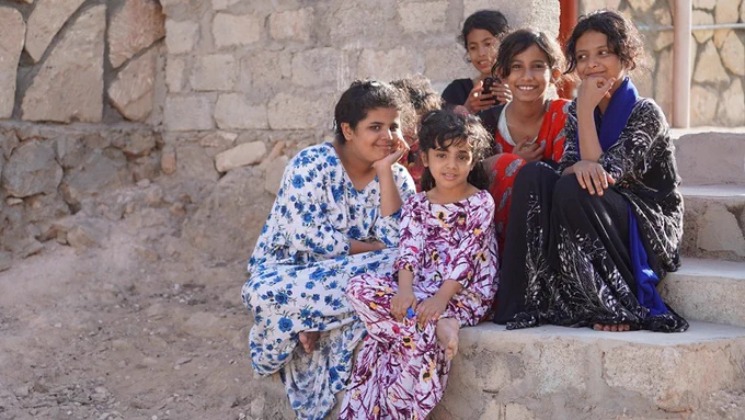 Girls gathering during the afternoon in the middle of the neighborhood to play and sing in Hawf city, Yemen.