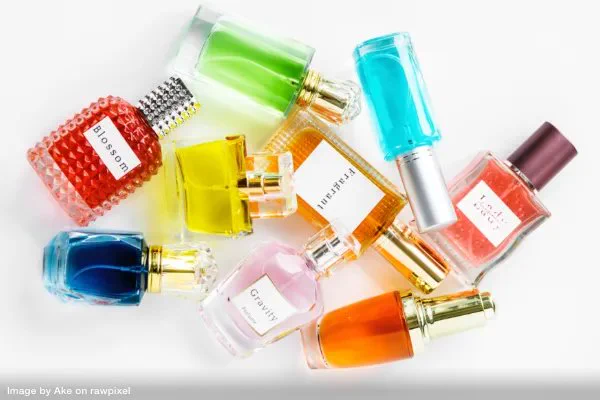 bottles of fragrances scattered on a counter representing things to declutter this year