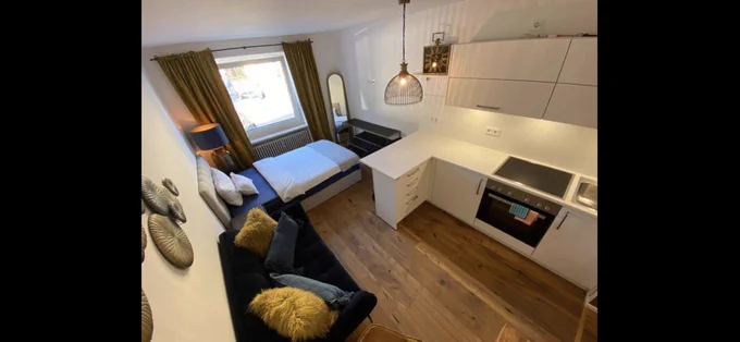 Same apartment for rent, showing bed pretty much in the kitchen.