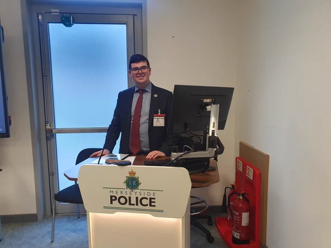 Jack Fitzpatrick at the Merseyside Police podium ready to present 