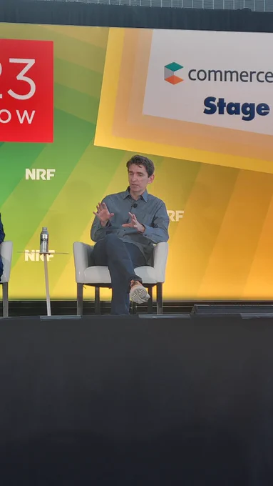 Man talking on stage at trade show 