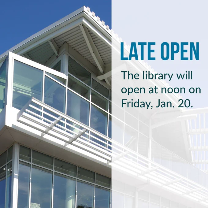 A photo of the exterior of the library with the words LATE OPEN