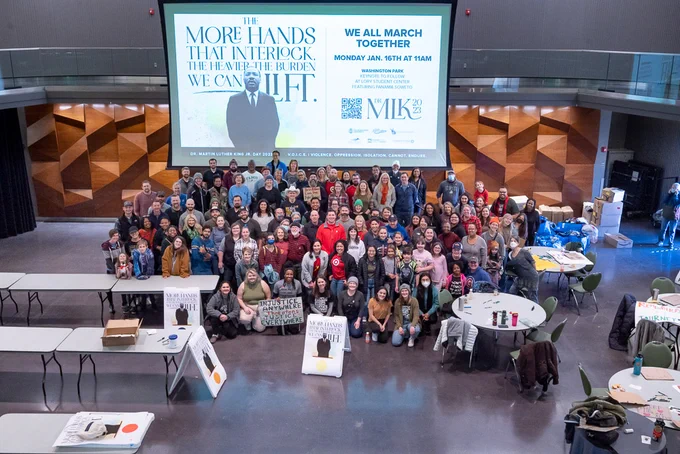 M L K Day of Service volunteers pose for a group photo in the Lory Student Center Theatre. 