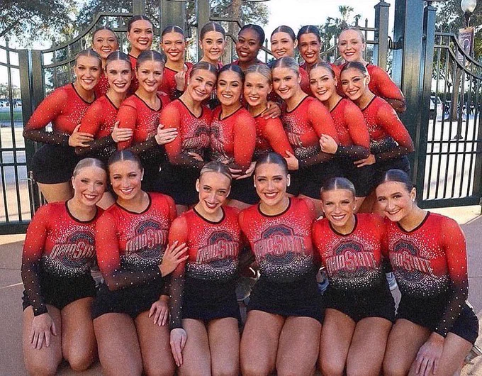 ohio state dance team members pose in their pom costume