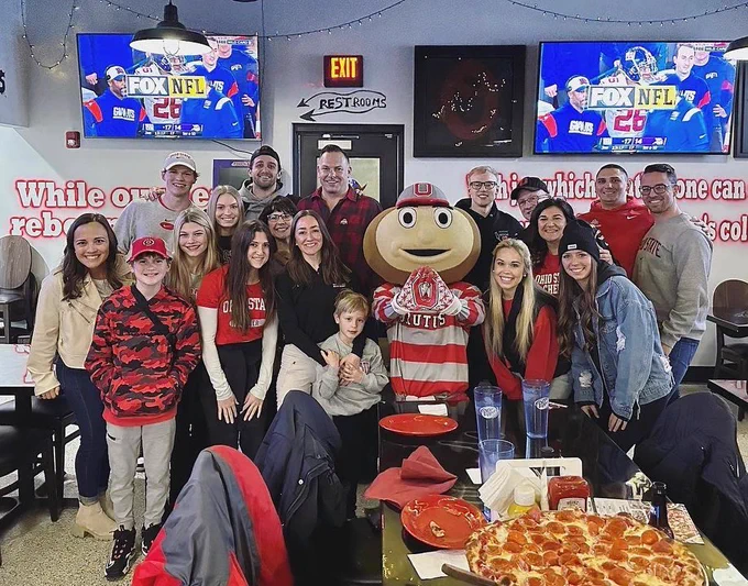 ohio state cheer and dance alumni pose with brutus