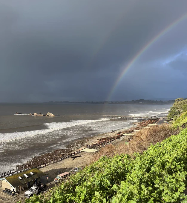 Rainbow in a cloudy sky over Seacliff State Beach