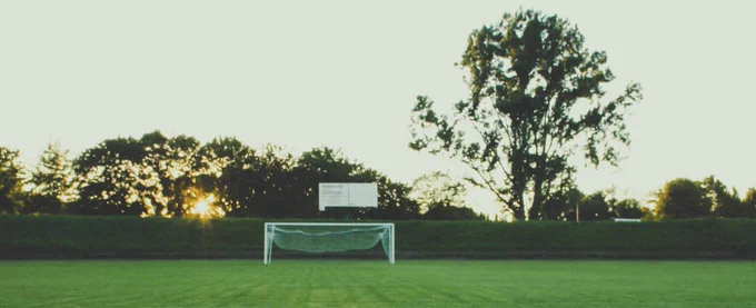 Sun going down on a football pitch