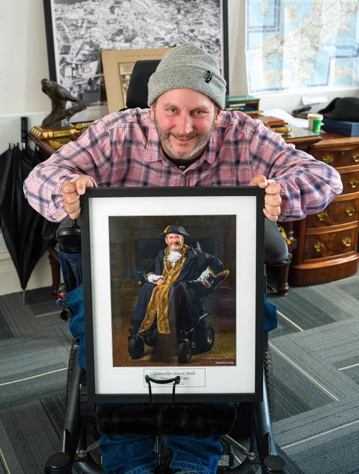 Steven Webb holding the the Mayor of Truro's portrait 2022