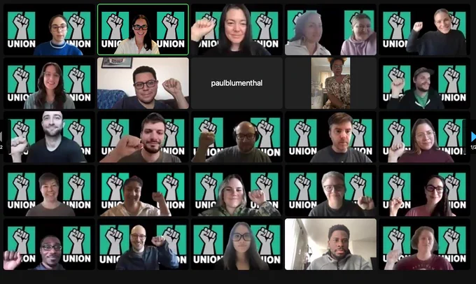 A grid of HuffPost union members on Zoom, with solidarity fists and union backgrounds!