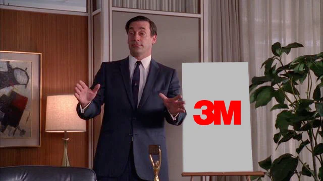 don draper pitching "3m" with the 3m logo on a board