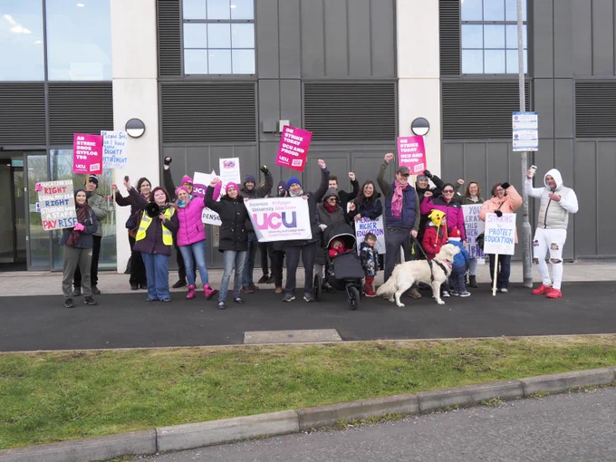Swansea UCU members with signs and dogs on the picket line 