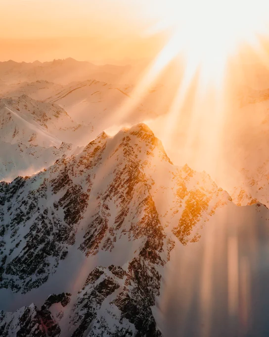 A mountain range as sunrise near talkeetna mountains. Photo taken by Alaskan photographer, Ellen Carty