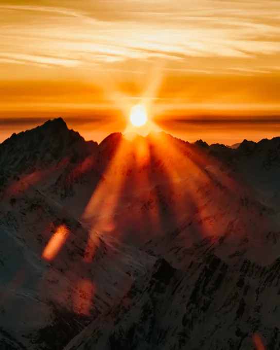 A mountain range as sunrise near talkeetna mountains. Photo taken by Alaskan photographer, Ellen Carty