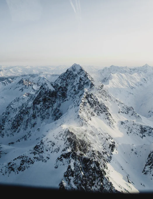 A mountain range as sunrise near talkeetna mountains. Photo taken by Alaskan photographer, Ellen Carty