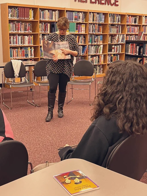 Mrs. B shares the book “Dreamers” with students