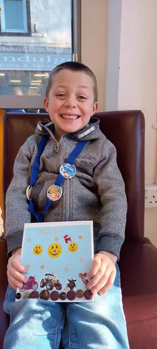 A child with a homemade card