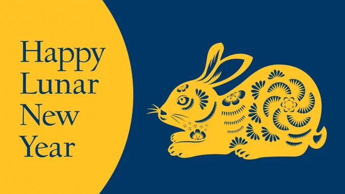 Illustration celebrating Lunar New Year. It is blue and gold with an illustration of a rabbit and the text Happy Lunar New Year.