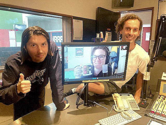 Billy and Dylan pictured in the studio giving a thumbs up alongside Rose on a computer screen